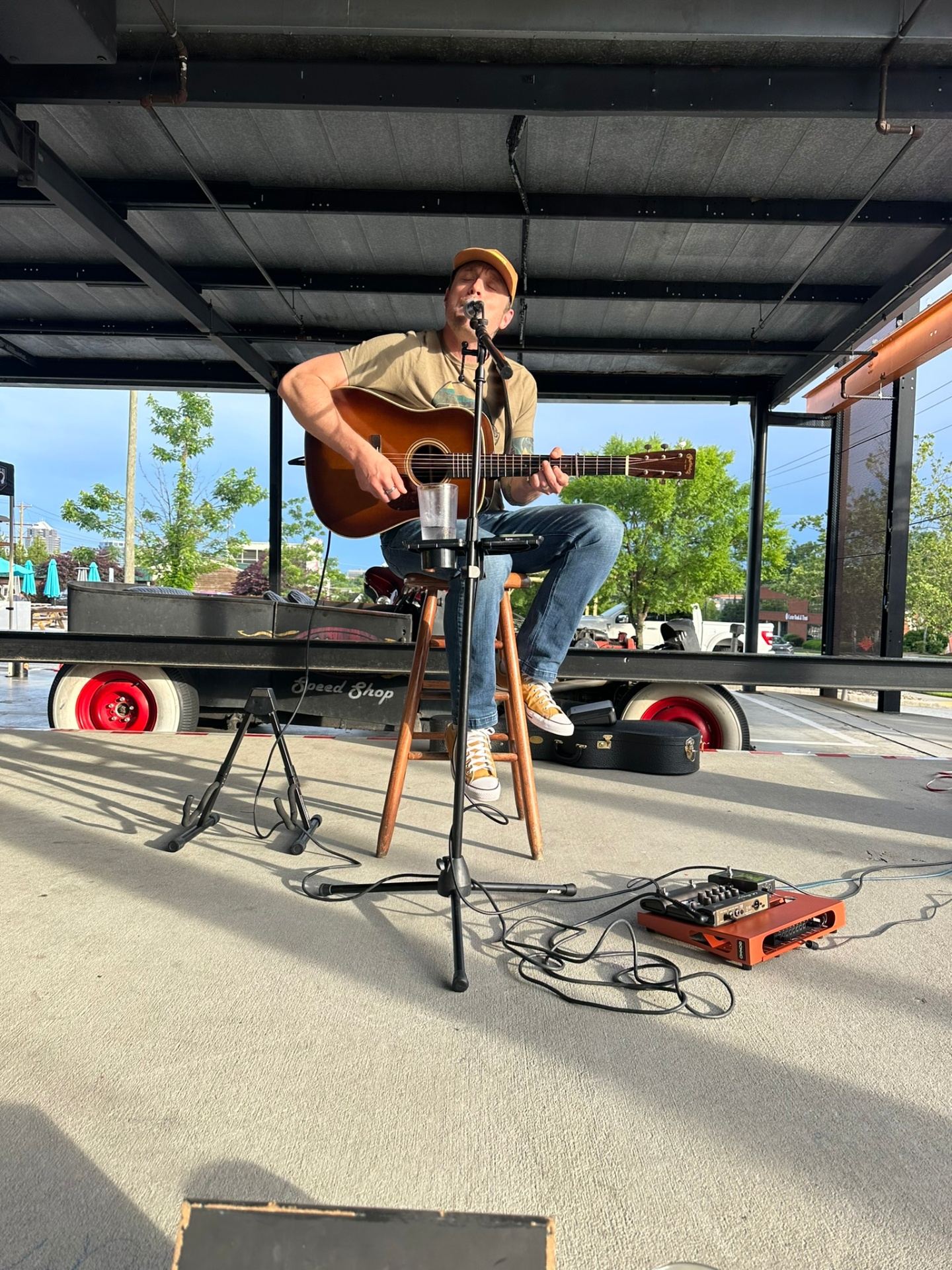 Kevin performing live under warm stage lighting